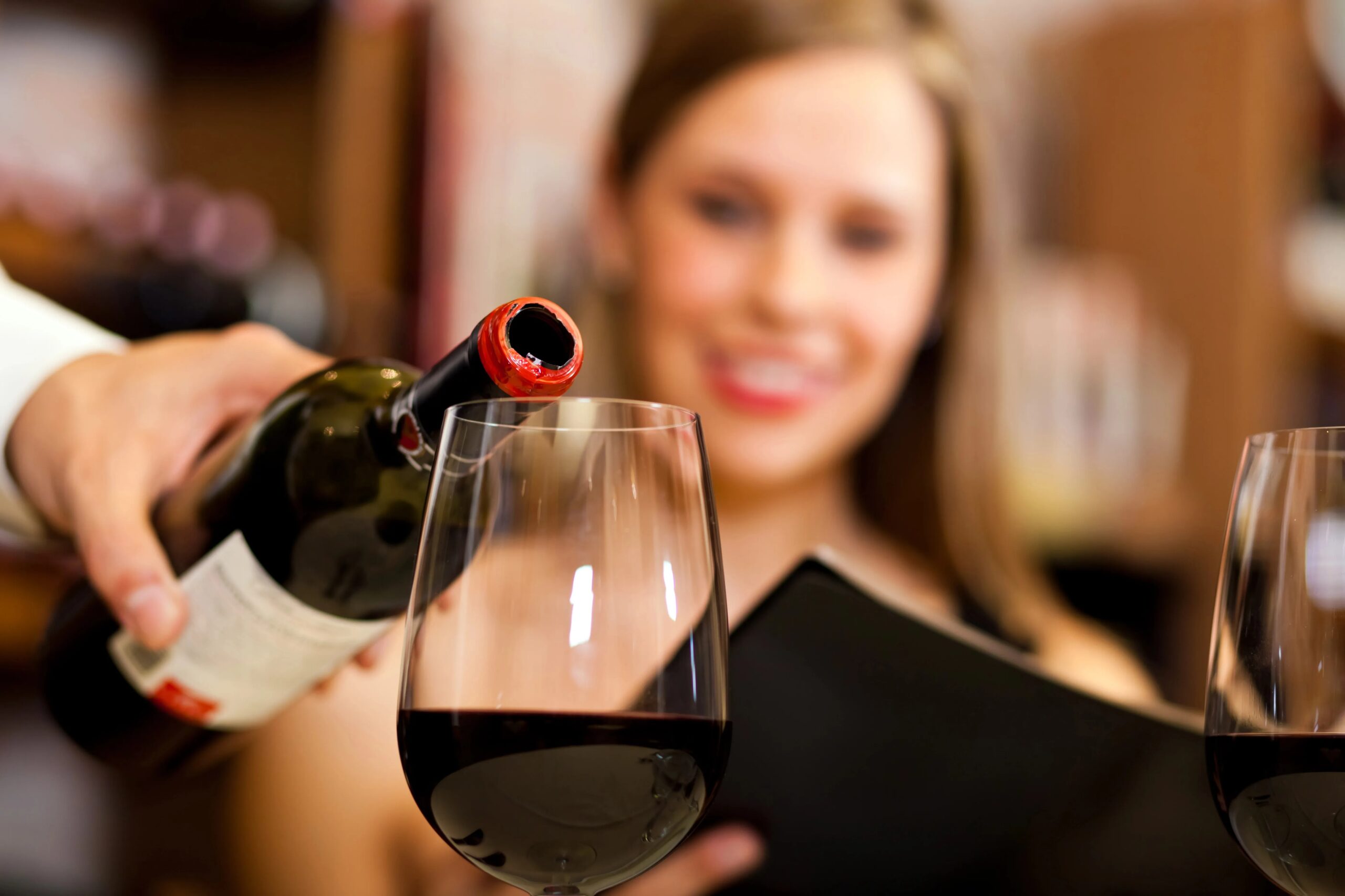 People engaging in a wine pairing experience, exploring the harmonious blend of flavors and textures.